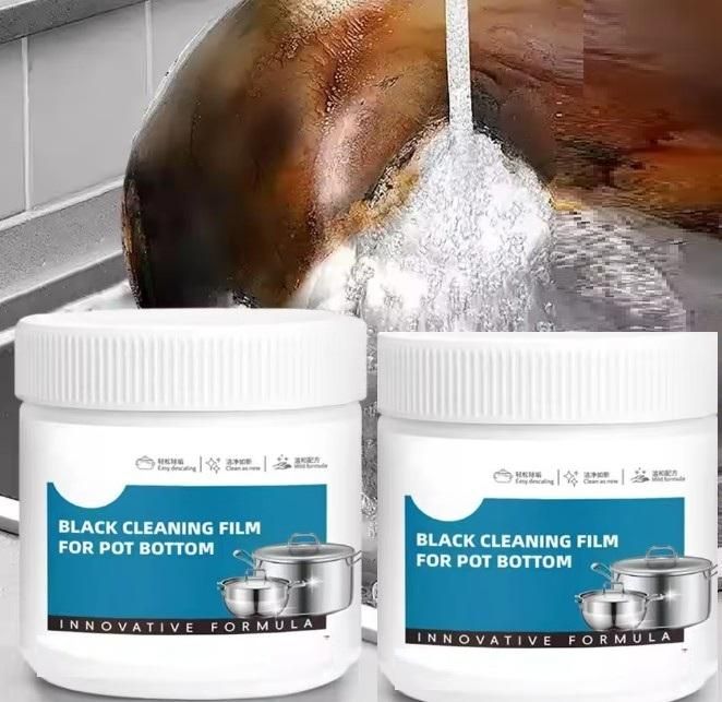 Two containers of black cleaning film for pot bottoms with a pot being cleaned.