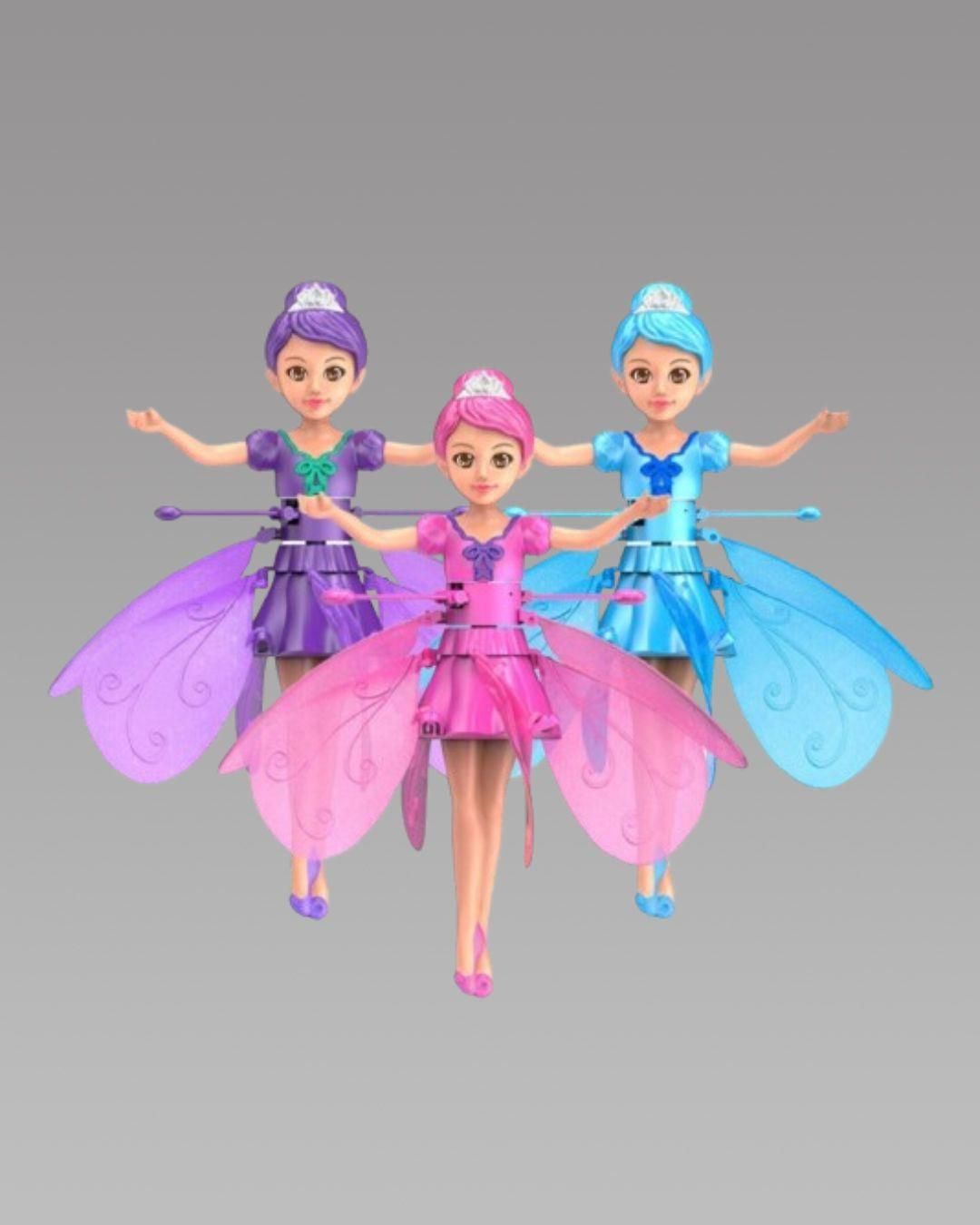 Three fairy dolls with colorful dresses and wings on a gray background
