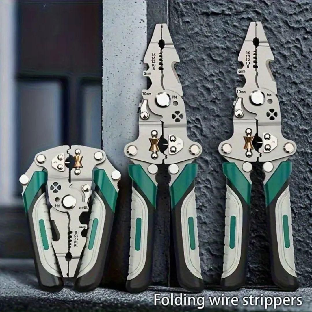 Three folding wire strippers with green and gray handles on a textured surface.