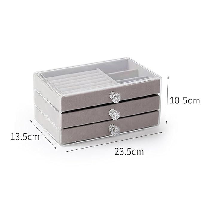 Gray jewelry organizer with three drawers and dimensions displayed