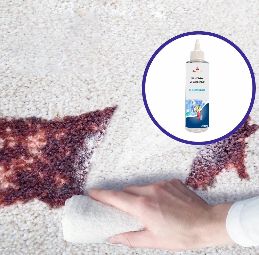 Person cleaning a carpet stain with a bottle of cleaning solution inset.