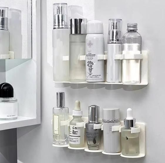 Shelf with various skincare products on a white wall