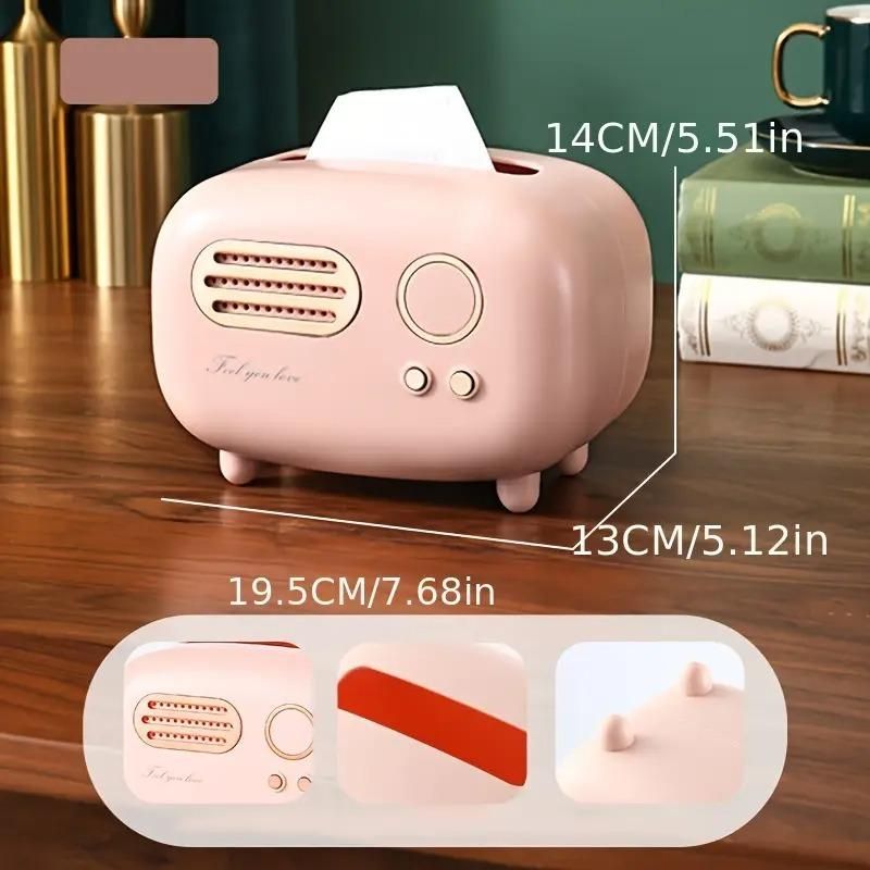 Pink humidifier with dimensions labeled on a wooden surface