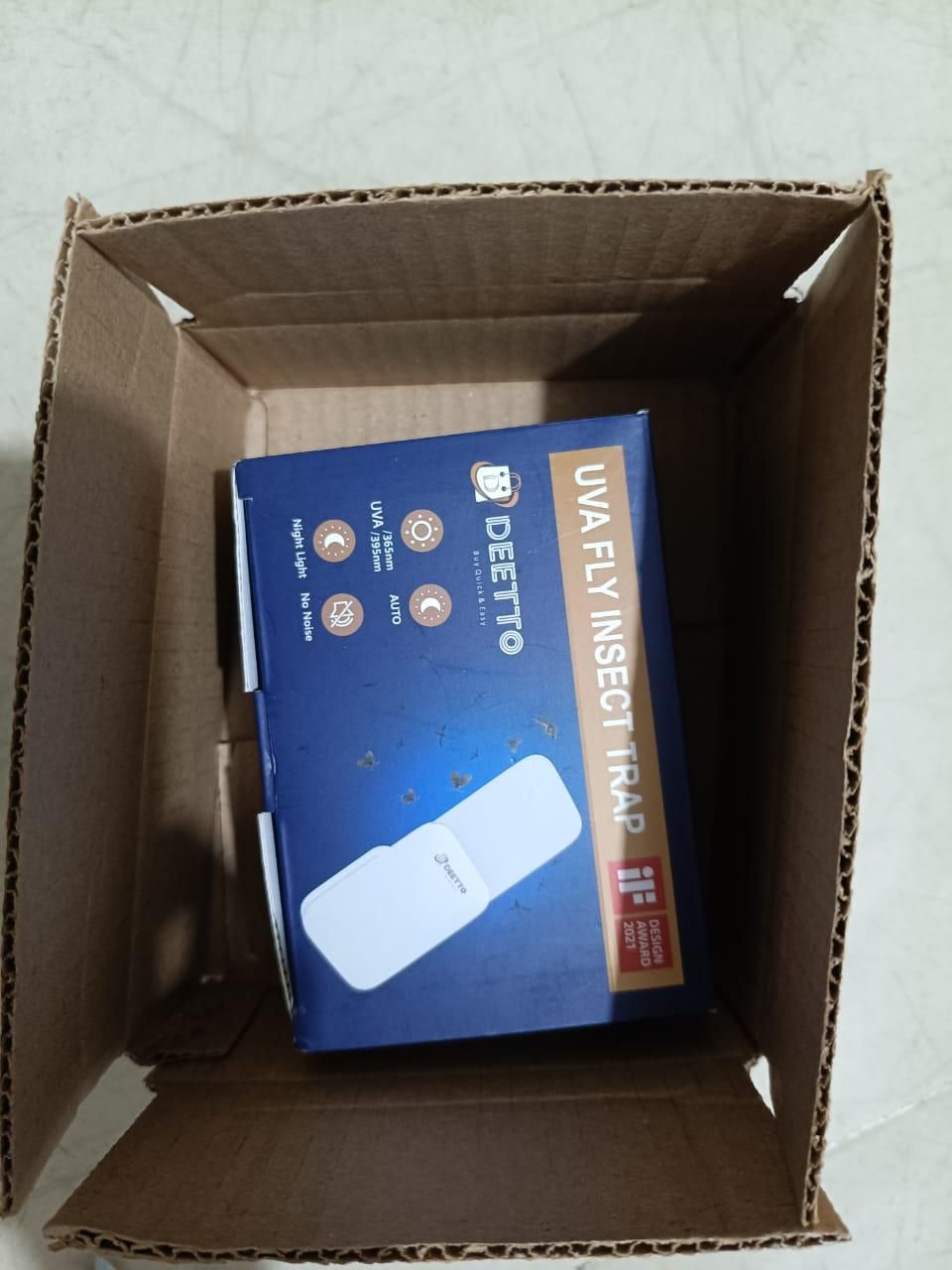 DEETTO UVA Fly Insect Trap packaging inside a cardboard box on a light gray background